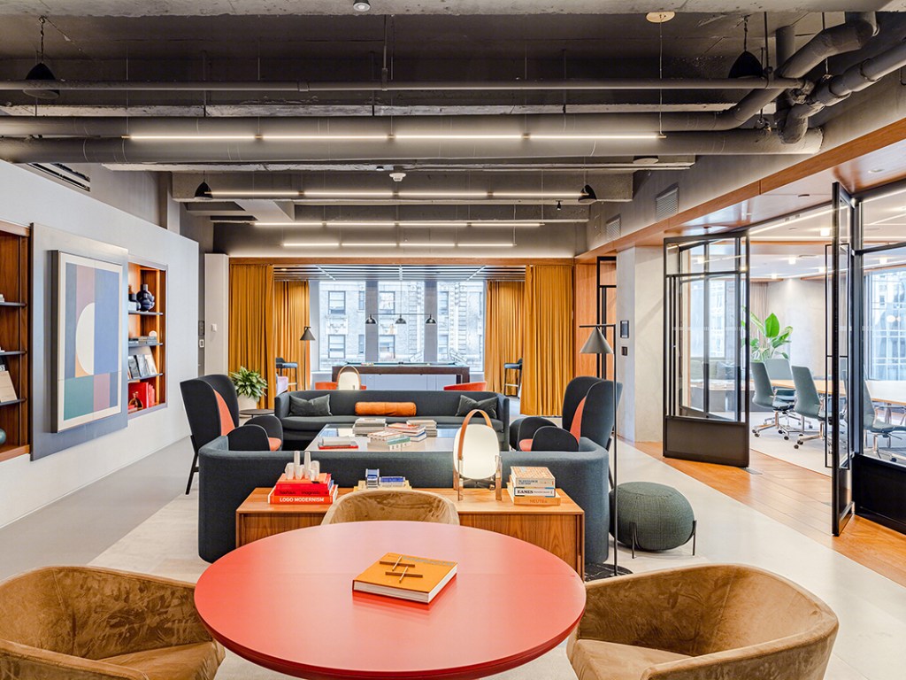 The lounge at 1700 Broadway. Modern spaces that promote socialization and collaboration are key to bringing tenants back into the office. Spaces such as the above have been a prime subject in many marketing campaigns encouraging new leases and returns to in-person work. Image courtesy of Rockpoint